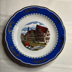Decorative Blue and White Plate with Gold Accents